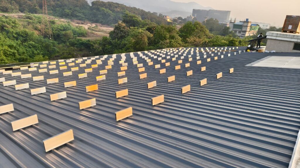 Rooftop solar panels with penetration-free mounting structure.